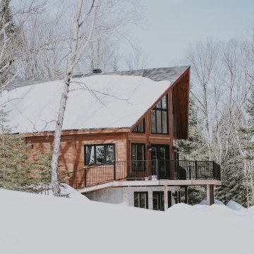 modern house with a snow covered roof